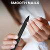 A hand holds a black nail clipper set, demonstrating smooth nails.