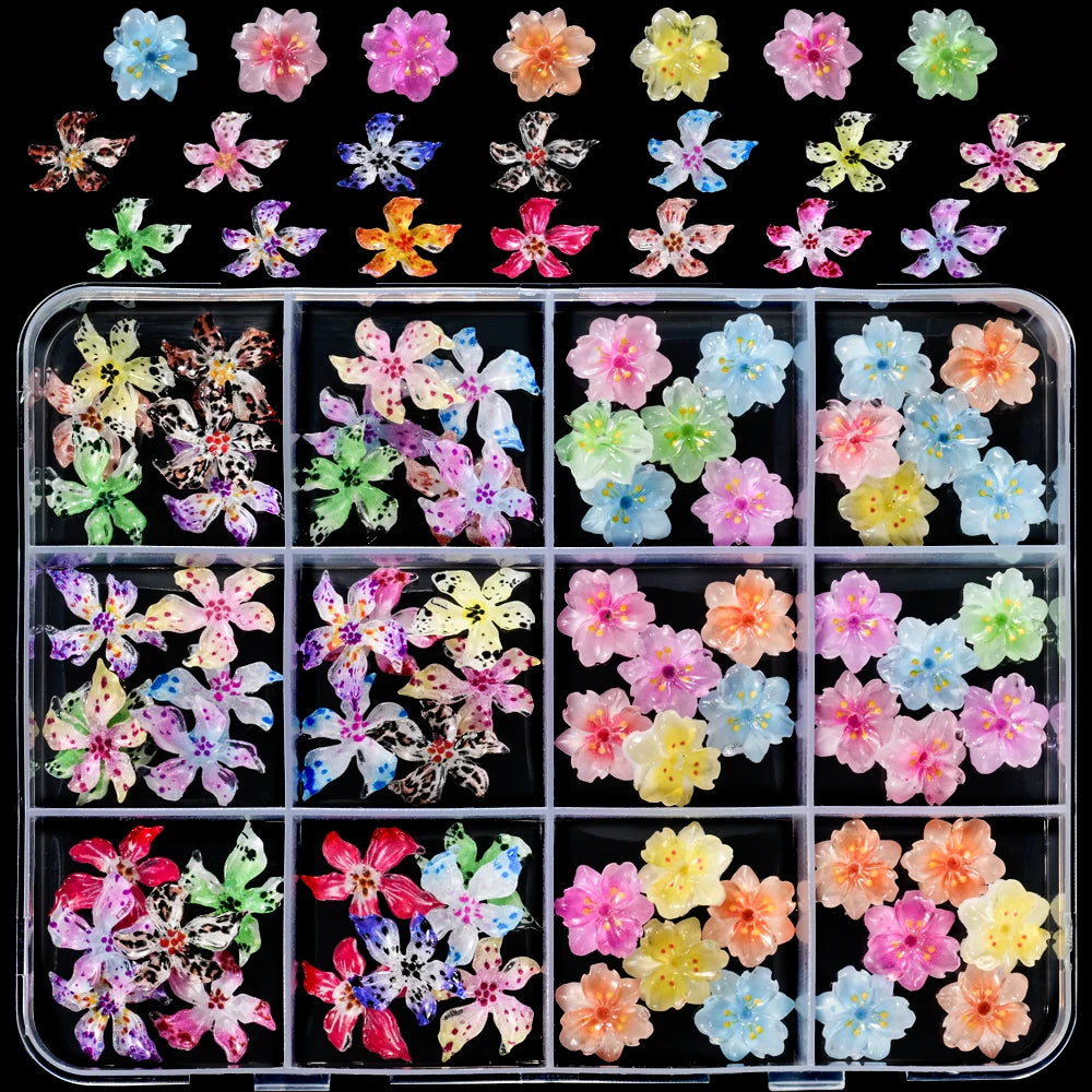 A collection of colorful floral resin nail charms featuring hibiscus flowers in various shades and patterns.