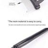 Close-up view of a black precision metal eyelash separator and curler with fine teeth spacing.