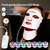 A woman is using a silicone LED mask for skin care, with various color masks displayed below.