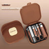 Ensemble de manucure anti-éclaboussure brun, 7 pièces comprenant divers outils et ciseaux à ongles.
