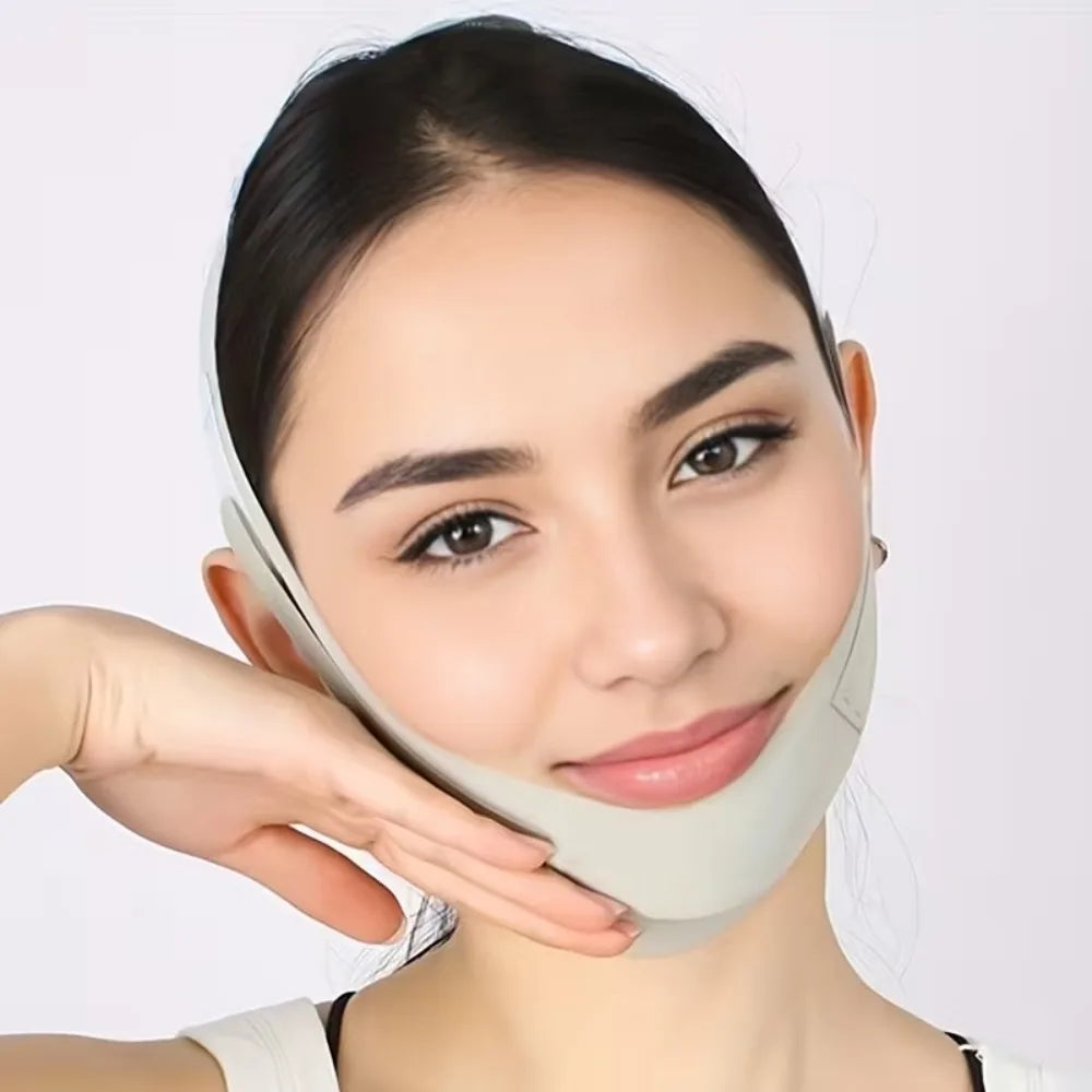 A woman is wearing an adjustable facial lifting strap for contour definition on her face.