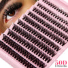 A close-up of a pink lash tray showing various clusters of black false eyelashes for volume extensions.