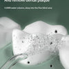 A white oral irrigator device is shown spraying water into a fine blind area to clean seam residue and dental plaque.
