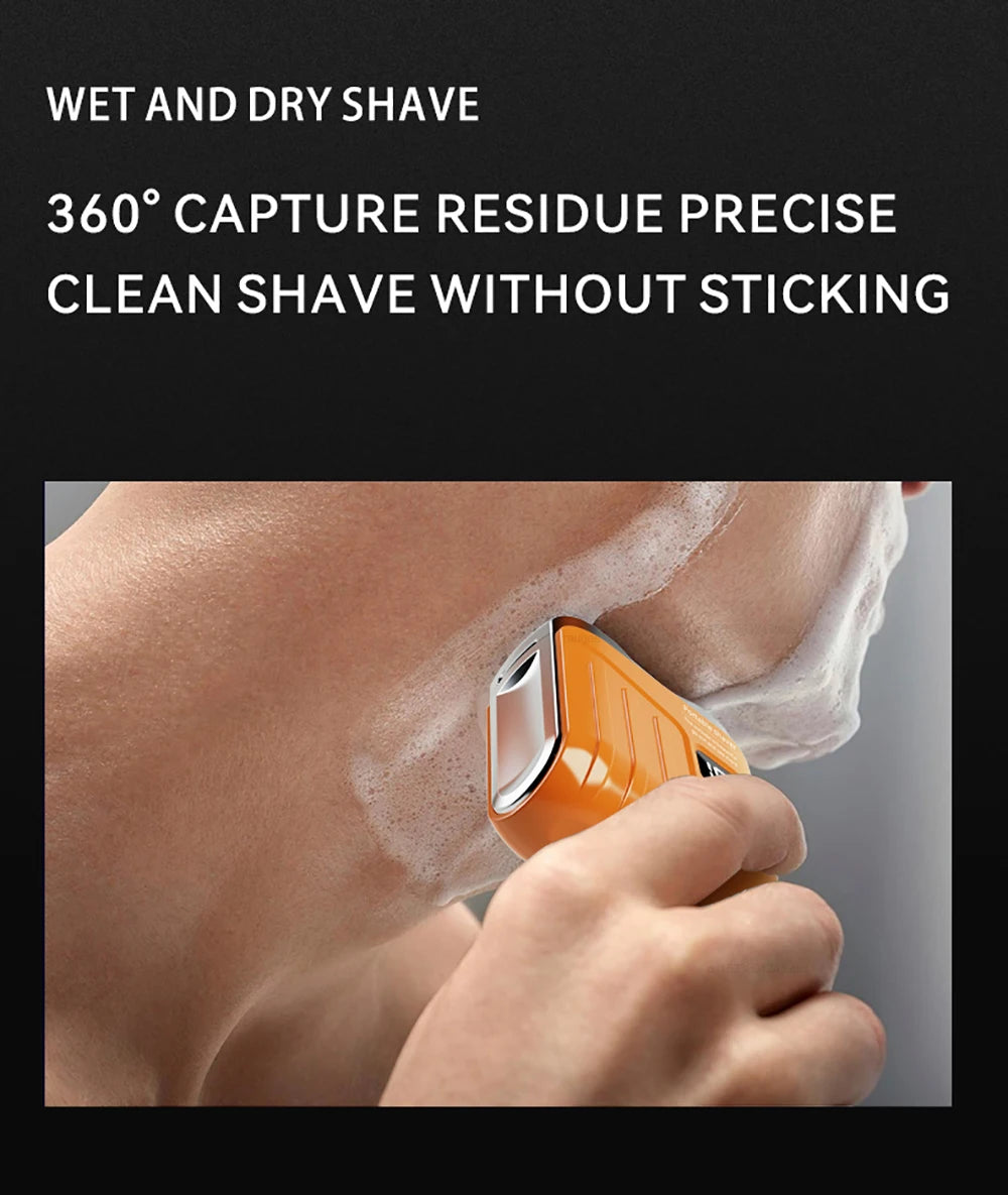 A close-up of an orange portable electric shaver being used on a person's skin with shaving foam.