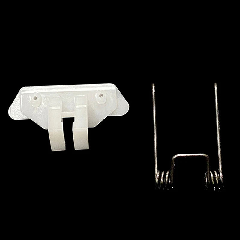 A white hair clipper swing head replacement parts kit showing a plastic housing and metal spring components.