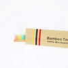 A package of bamboo toothbrushes with colorful bristles and branding text.