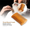 A close-up of a wooden beard comb being used on a man's beard, showing the double-teeth design.