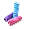 A stack of blue and purple fitness foam rollers for muscle recovery.