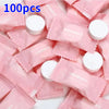 A pile of pink disposable wet wipes with white wipes visible inside.