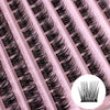 Close-up of a pink eyelash strip with black mink false eyelashes applied in a fan pattern.