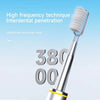 A close-up of a silver electric toothbrush with a white bristles, showing the high frequency technique for interdental penetr