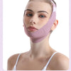 A woman wearing a pink facial lifting strap designed for contour definition.