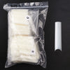 A clear plastic bag containing a set of 504 acrylic false press-on nails, including six and eight nails, next to a single nai