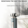 A Kemei professional razor with a magnetic detachable head shown standing on a wooden surface.