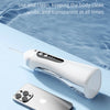 A white portable rechargeable oral irrigator device is shown next to an iPhone, highlighting its waterproof and washable feat