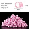 A pile of pink heart-shaped disposable glue rings for eyelash extensions and nail art