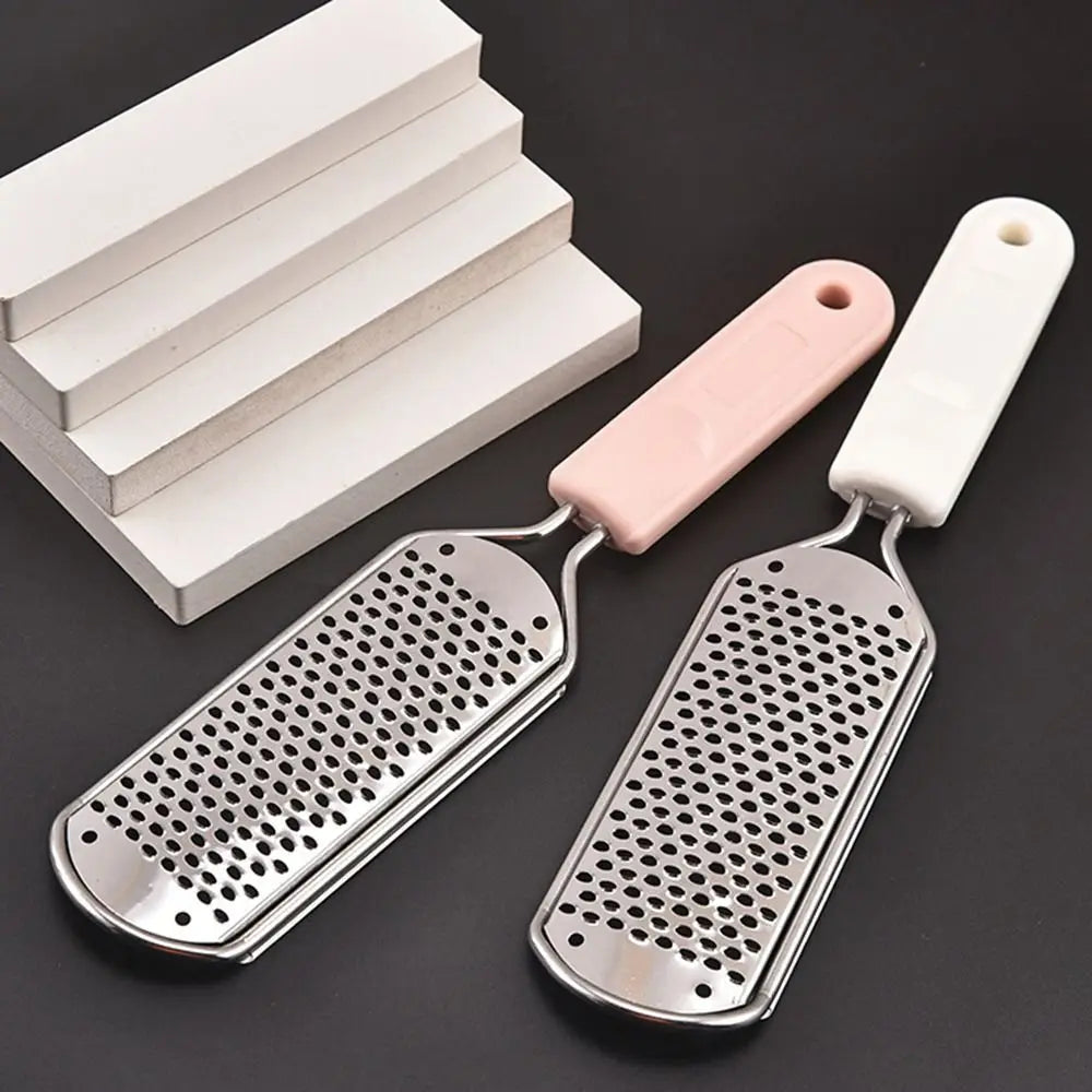 Stainless steel foot file with a pink handle and a perforated metal surface for callus removal