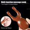 A wooden multi-function massage comb used to relieve eye fatigue on the face.
