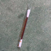 A clear plastic tube containing a white instant iodine swab for wound care.