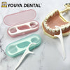 A set of portable dental cleaning tools including a pink floss holder and a white cleaning stick on a marble surface.