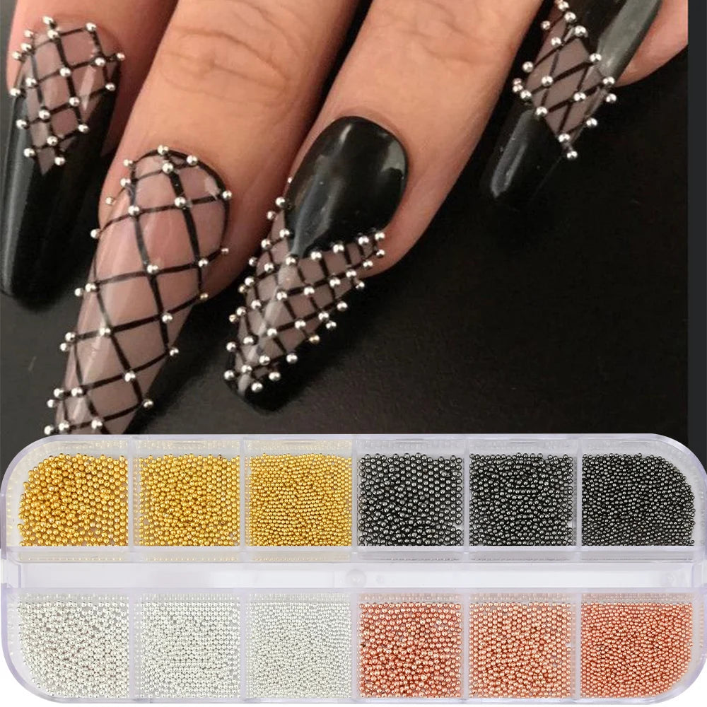 A collection of gold mixed stainless steel bead nail art decorations in various shades and sizes.