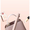 A light pink ceramic hair straightener and curler is shown in a compact form, ready to be carried in a bag.