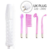 A white facial rejuvenation device with four pink silicone tools and a UK plug for facial treatment.