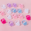 A collection of pink and blue disposable glue rings for eyelash extensions and nail art