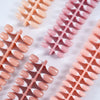 Matte pink artificial fingernails shaped like French press for nails