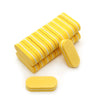 A stack of yellow nail buffing blocks with white stripes and a single yellow oval block on a white background.