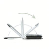 A silver portable compact comb with an attached black brush and a mirror, shown at an angle.
