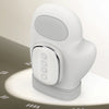 A white electric hand massager device shown from the side, resting on a light surface.