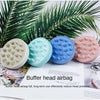 A set of pink, blue, and white rubber buffer head airbags for scalp massage shown against a green palm leaf background.