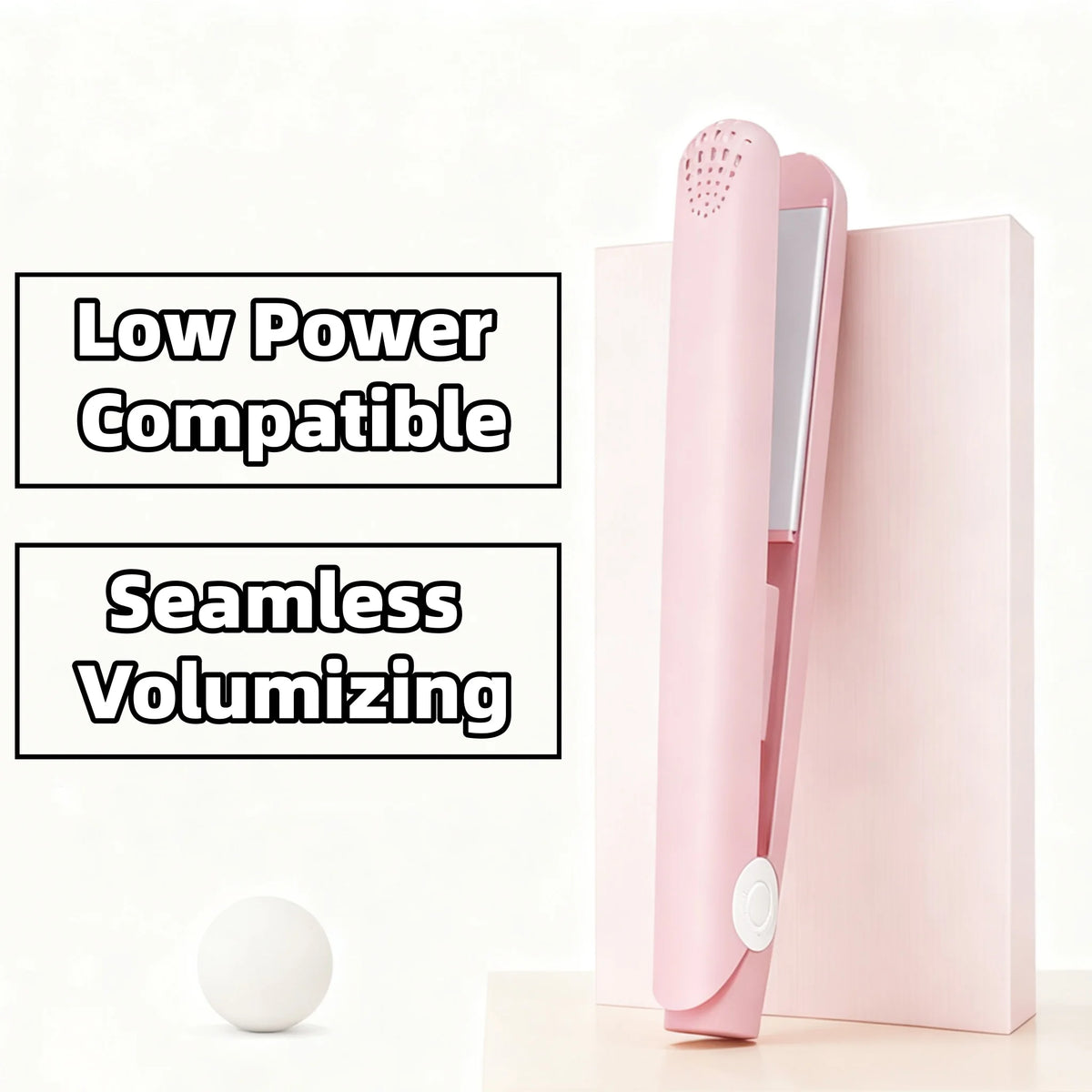 A pink mini portable flat iron hair straightener and curler shown next to a white sphere.