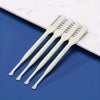 A set of white 360° rotating nose and ear hair trimmers displayed on a blue surface next to a white marble slab.