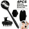 A set of four black silicone bath and body brushes including a long handle brush and a flat brush for exfoliation.