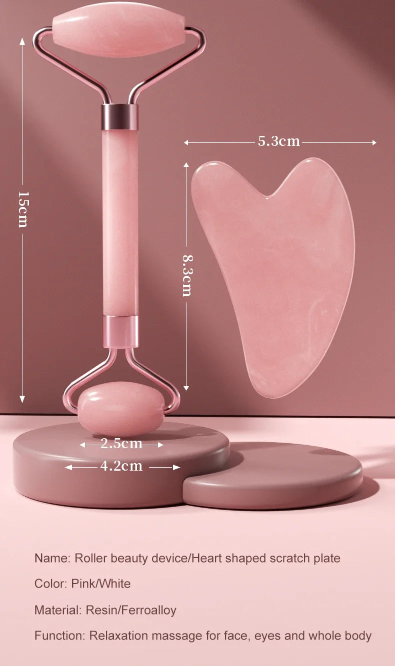Pink beauty device featuring a heart-shaped scratch plate and roller for relaxation massage
