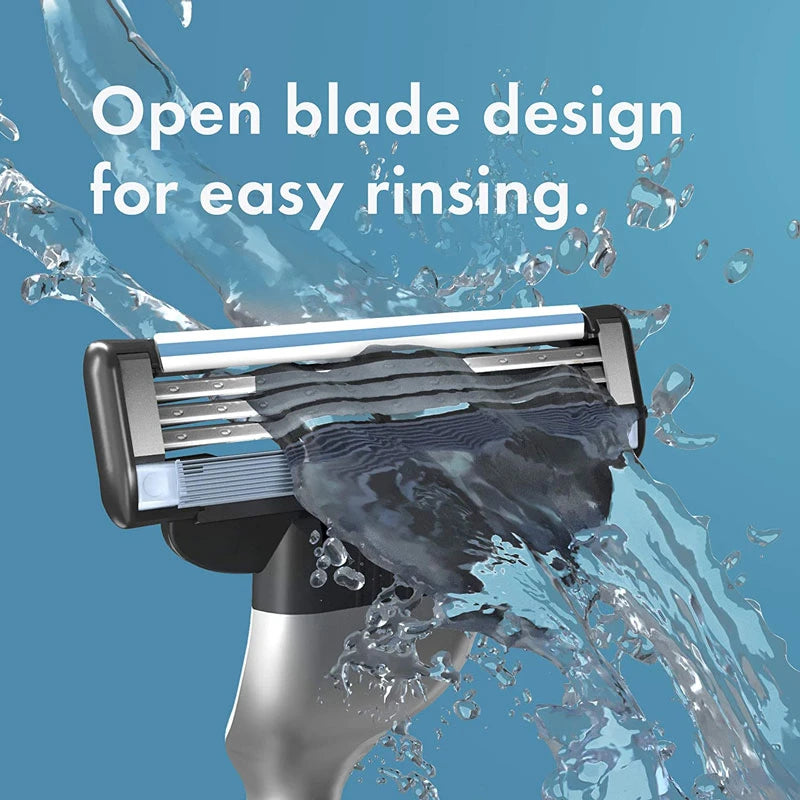 A close-up of a Gillette Mach3 manual razor with an open blade design being rinsed under water.