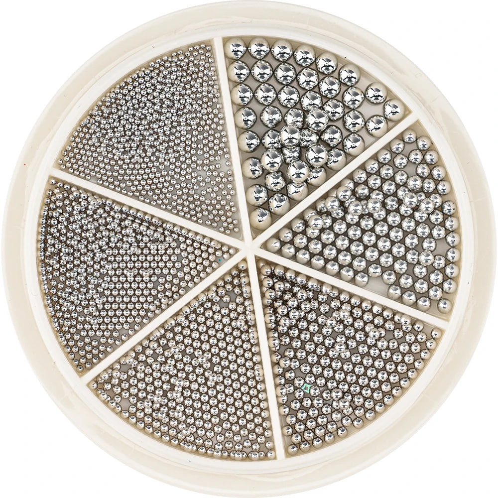 A circular display of gold mixed stainless steel bead nail art decorations arranged in radial sections.