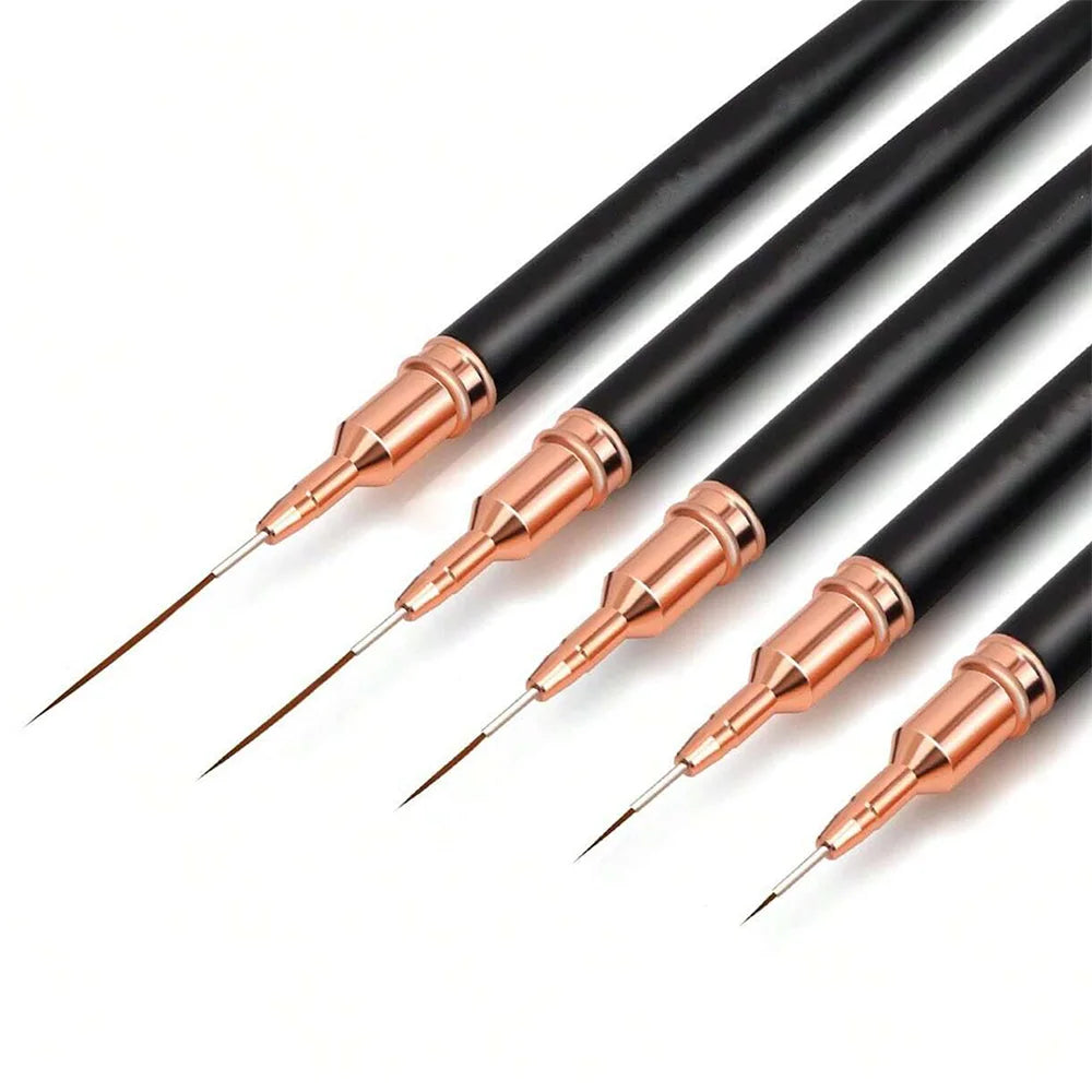 Un set de pinceaux pour liner de nail art professionnels noirs et rose gold, montrés en diagonale.