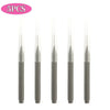 A set of five mini brow and eyelash combs in a gray color.