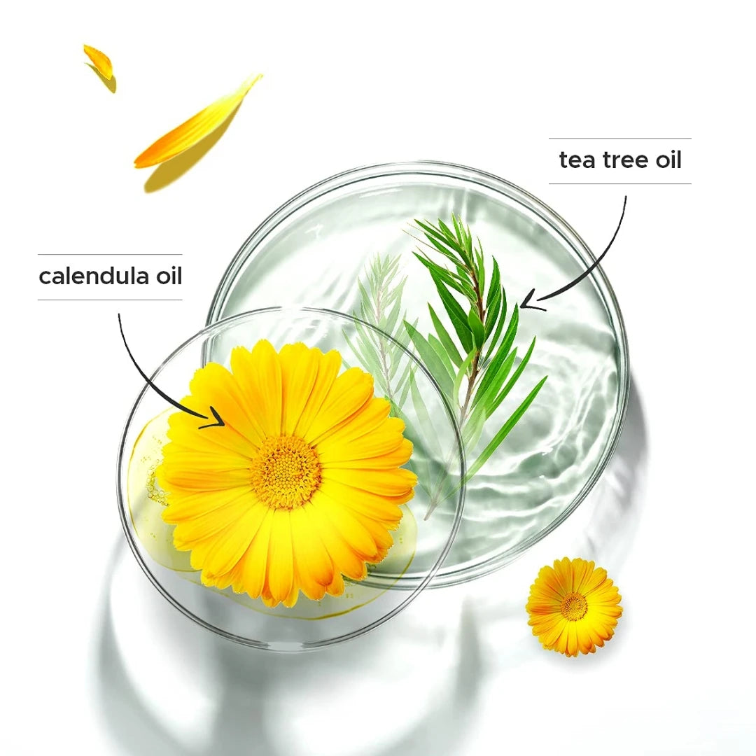 A glass dish shows calendula oil and tea tree oil next to a yellow flower, with a single flower patch visible.