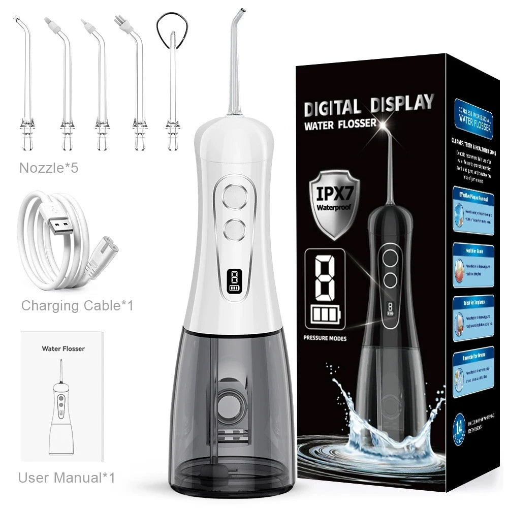 A black and white digital display water flosser device with accessories shown next to its packaging.