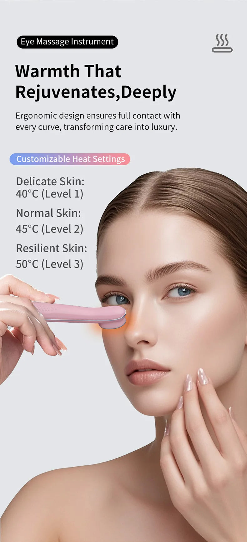 A woman is using a pink eye massage instrument on her face to rejuvenate the skin.