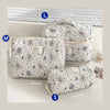 A set of quilted cotton makeup bags in white and gray patterns shown with various size measurements.