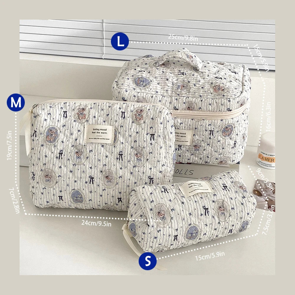 A set of quilted cotton makeup bags in white and gray patterns shown with various size measurements.