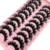 Plateau en plastique rose contenant un ensemble de faux cils de renard noirs.