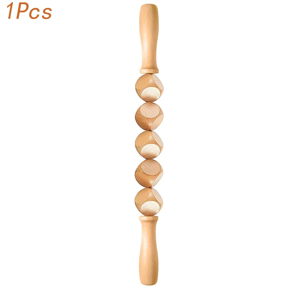 A natural wood gua sha roller with a handle and several rounded stones for facial massage.
