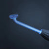 A close-up view of a glowing blue high-frequency skin rejuvenation wand tip against a dark background.